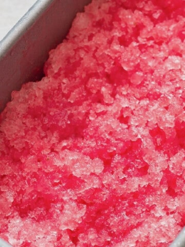 close up view of watermelon granita in a tray.