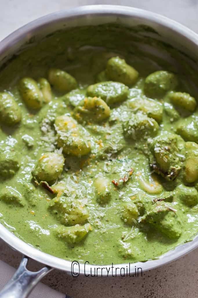 pesto gnocchi cooked in skillet pan