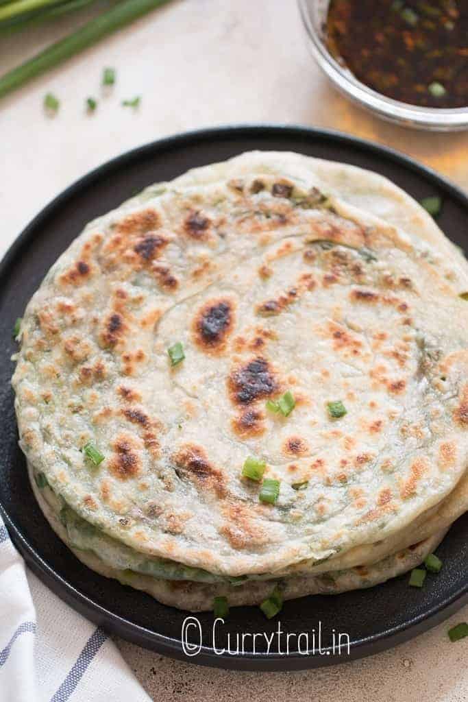 green onion pancakes stacked on each other