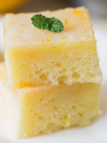 moist fudgy lemon brownies stacked up with mint leaves