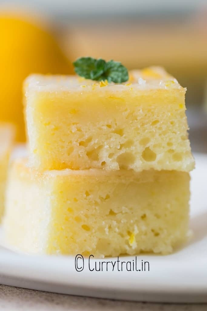 close up of 2 slices of lemon brownies stacked up