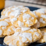 lemon crinkle cookies stacked on plate