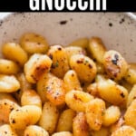 pan fried gnocchi cooked in skillet with text overlay