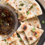 scallion pancakes with dipping sauce with text overlay