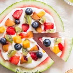 watermelon dessert pizza with cheesecake frosting and fruits