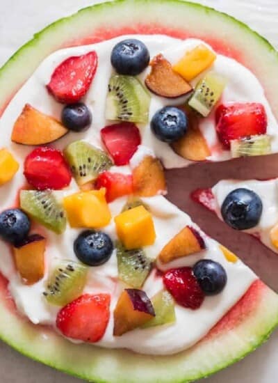 watermelon dessert pizza with cheesecake frosting and fruits