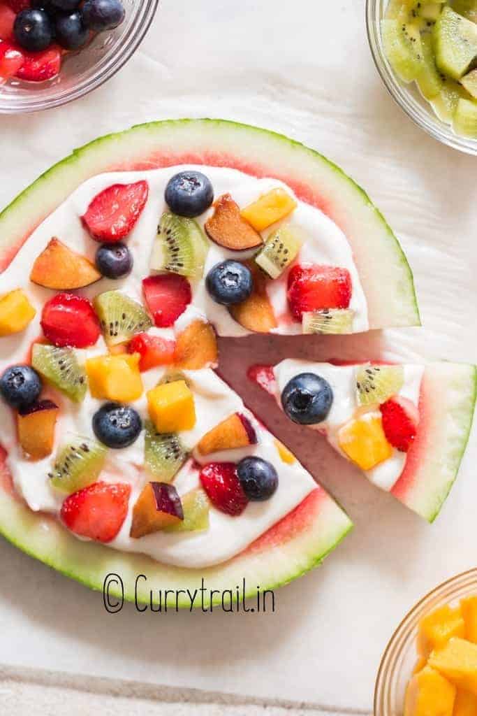 watermelon dessert pizza with cheesecake frosting and fruits