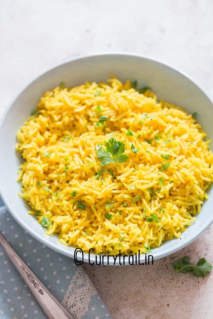 bright yellow turmeric rice in bowl