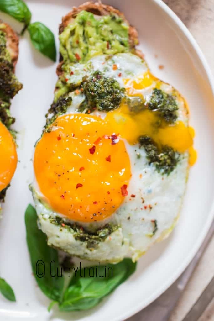 close up view of pesto egg avocado toast