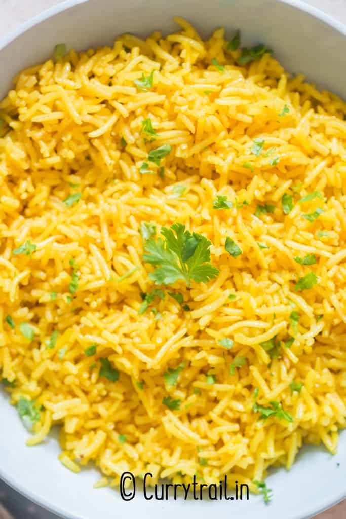 bright yellow turmeric rice in bowl
