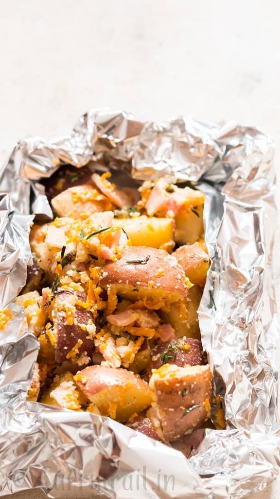 diced potatoes mixed with cheese packed in aluminum foil packs.