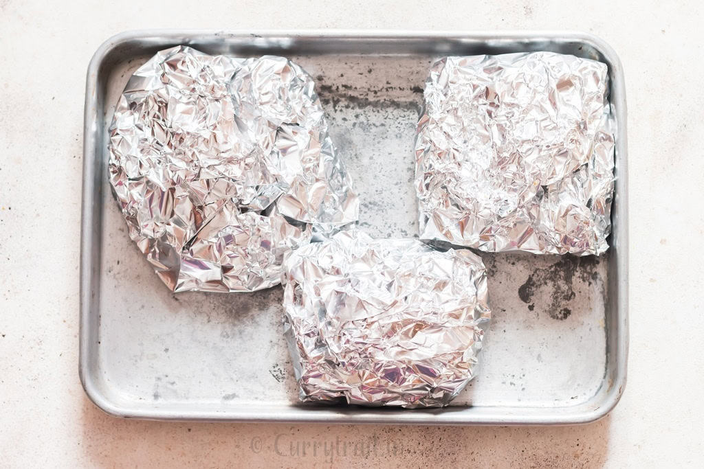 diced potatoes mixed with cheese packed in aluminum foil packs.