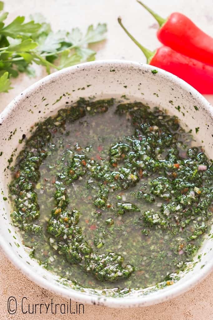 rustic chimichurri sauce in a bowl.