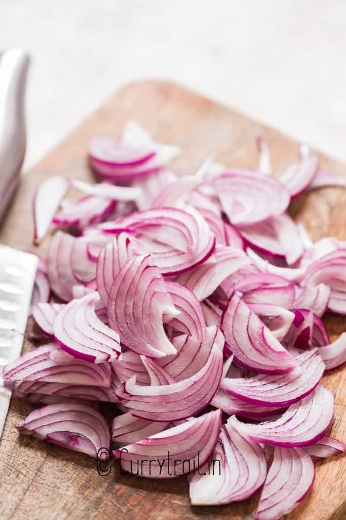 sliced red onion on cutting board