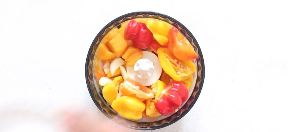 all ingredients for mango habanero hot sauce in a food processor.