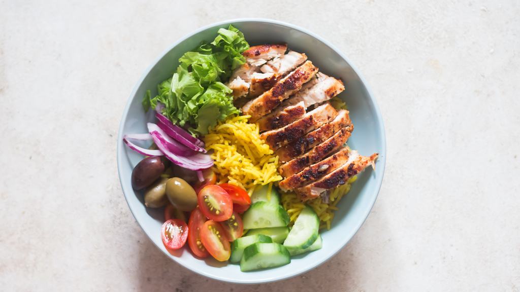 assembling chicken shawarma bowl