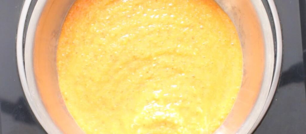 cooking hot sauce with mango and habanero peppers.