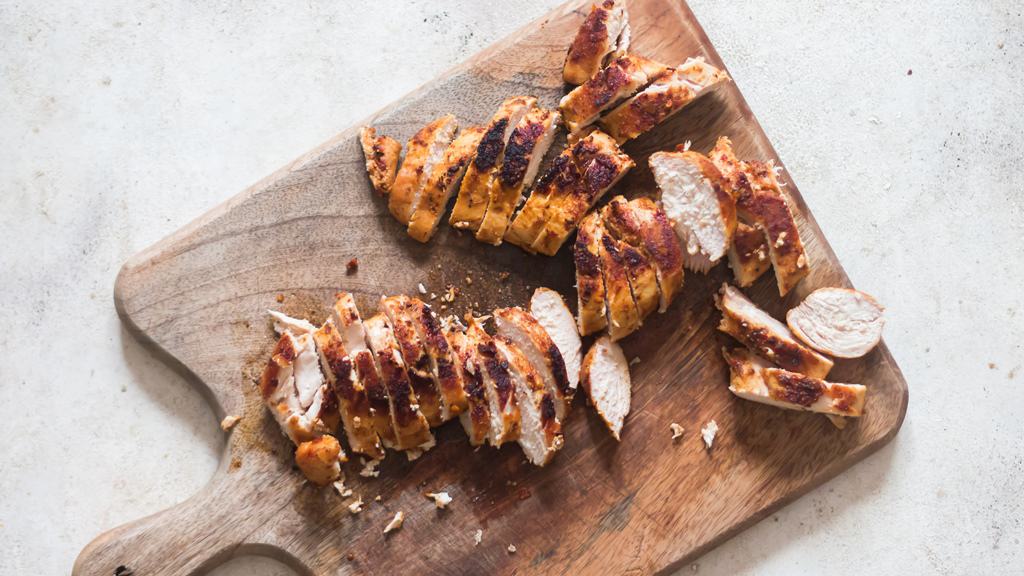 sliced chicken shawarma on cutting board