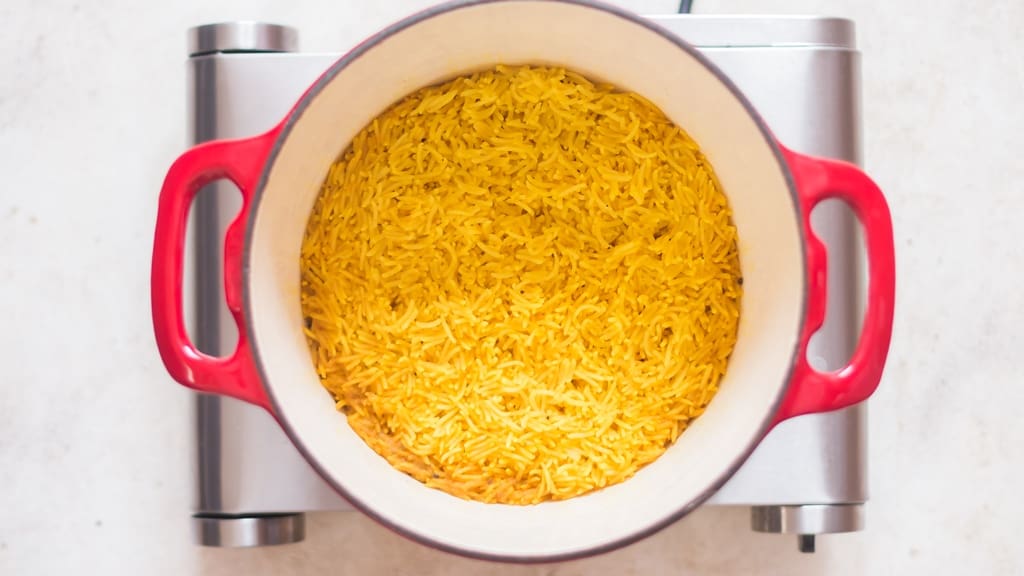 fluffy long-grain turmeric rice in a pot.