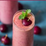 cherry smoothie made with 4 ingredients served in 2 glass with text overlay