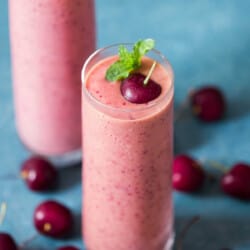 cherry smoothie made with 4 ingredients served in 2 glass