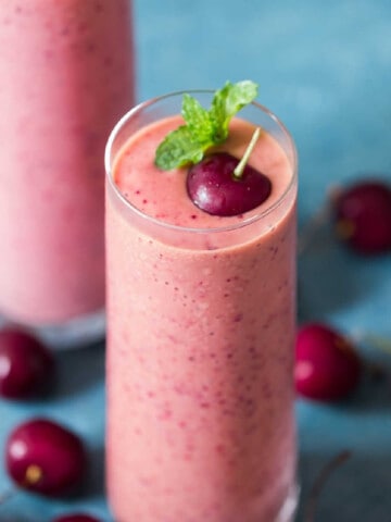 cherry smoothie made with 4 ingredients served in 2 glass