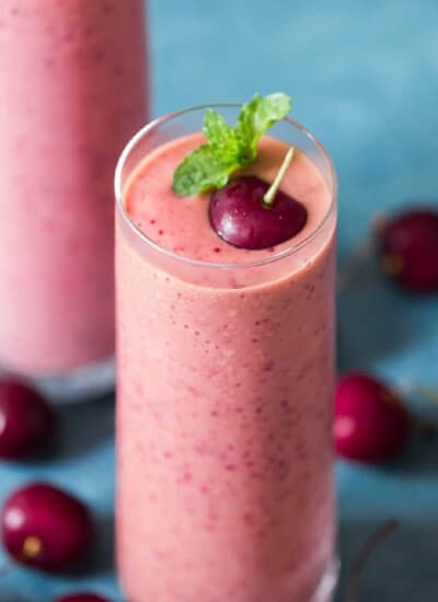 cherry smoothie made with 4 ingredients served in 2 glass