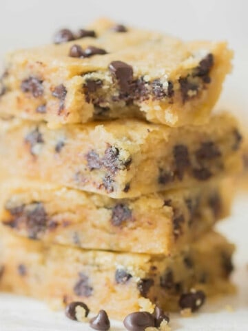 cookie bars with chocolate chips stacked up