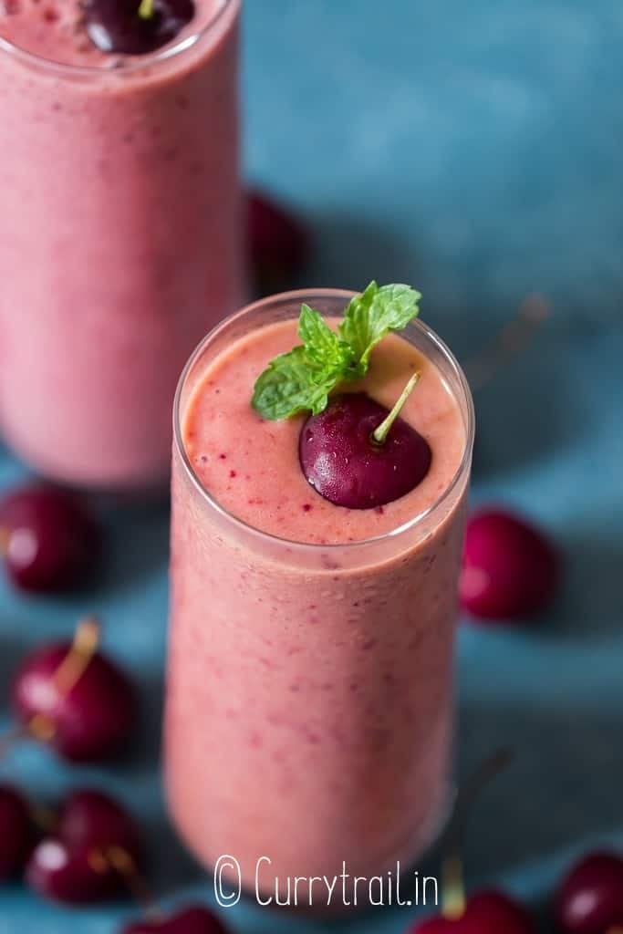 cloes up of cherry smoothie in 2 glasses