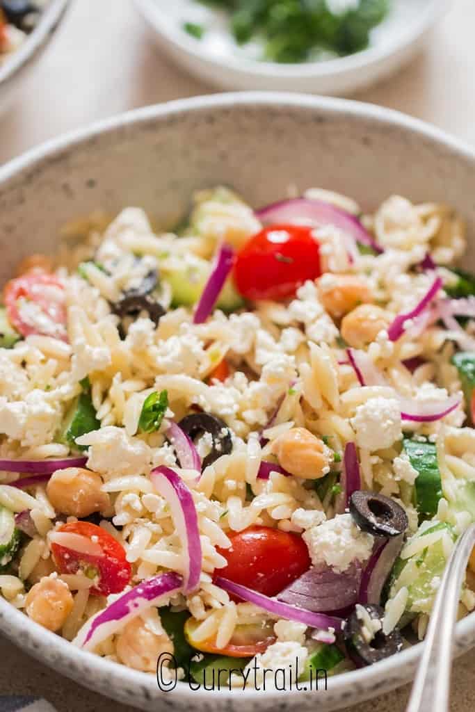 summer cold pasta salad made using orzo pasta