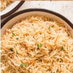 rice pilaf in serving bowls with text