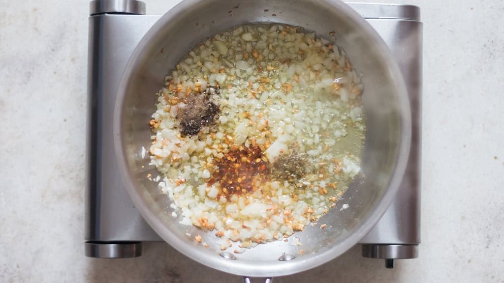 onion, garlic sauteed in olive oil with salt, pepper, and red chili flakes.