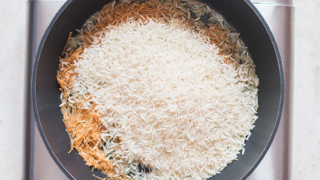 long grain rice and vermicelli sautéed in a skillet.