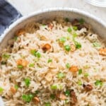 garlic butter rice in ceramic bowl with text