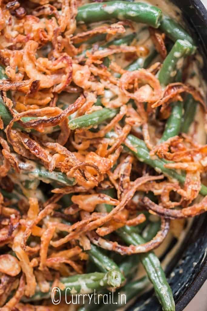 green beans cooked in creamy gravy with crispy onions on top
