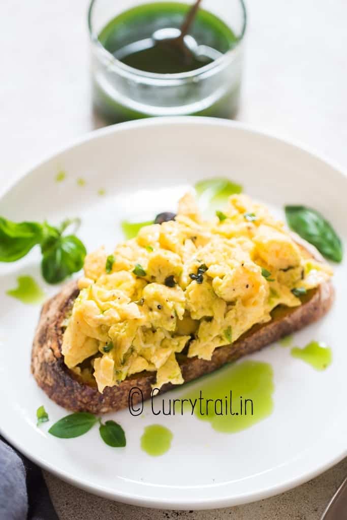 basil oil drizzled over scrambled eggs
