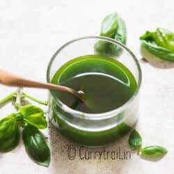 fresh basil infused olive oil in small jar