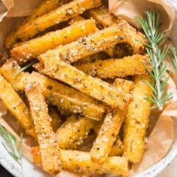 crispy baked fries made of polenta in bowl with ketchup on side