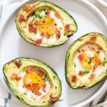 egg in avocado with bacon and chives