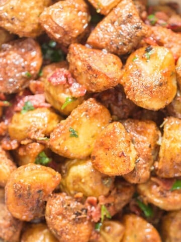 crispy parmesan crusted roasted potatoes with crispy bacon on top