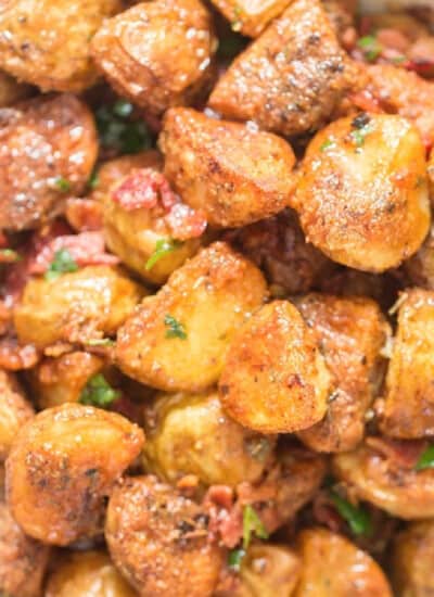 crispy parmesan crusted roasted potatoes with crispy bacon on top