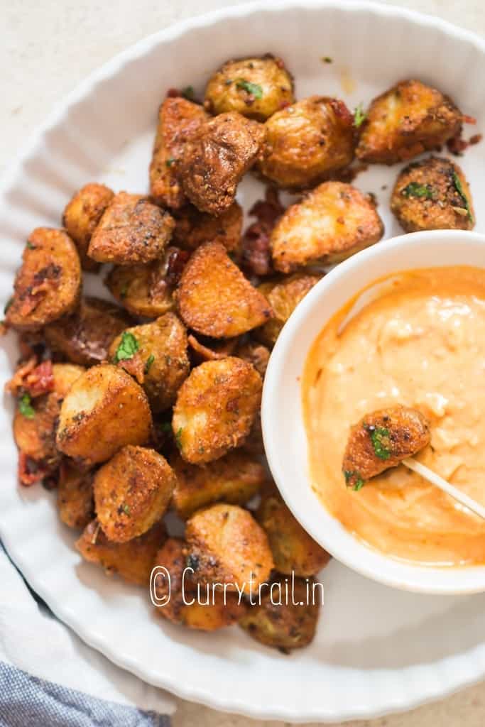 crispy parmesan potatoes roasted served with dipping sauce