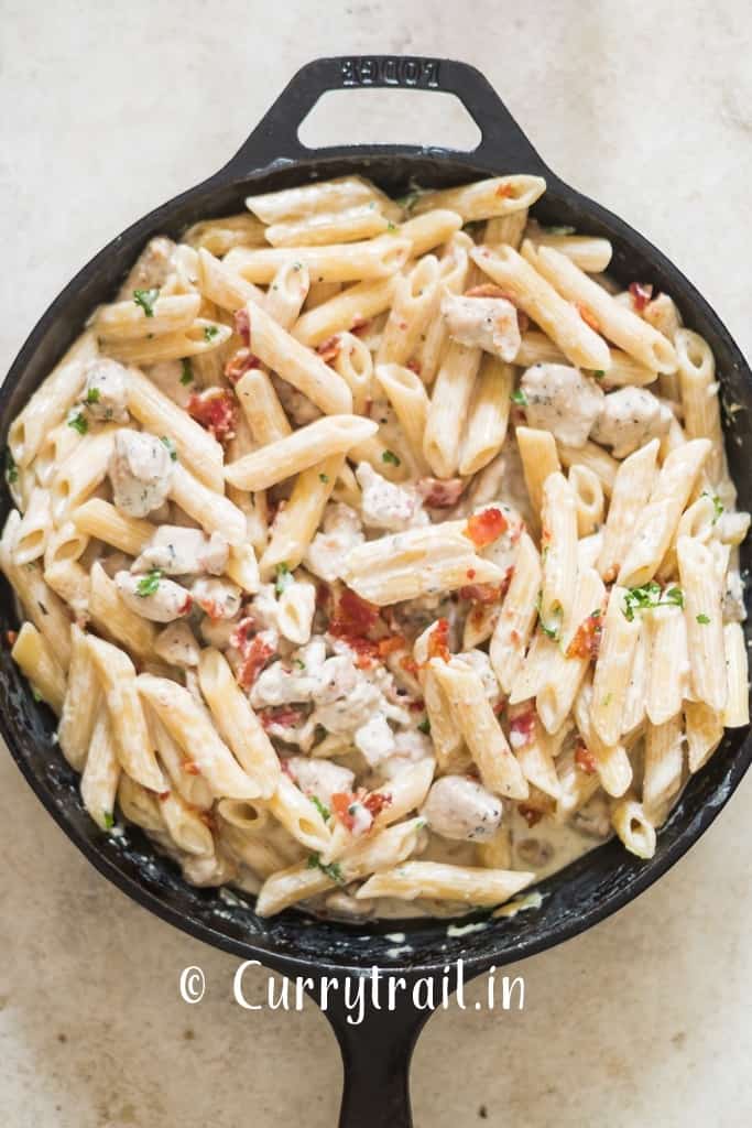 creamy chicken pasta in cast iron pan