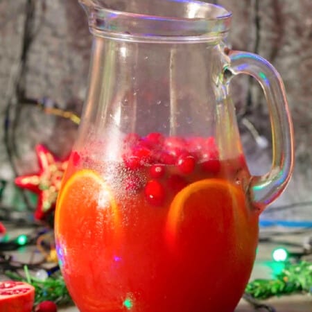 pitcher full of Christmas cranberry punch drink