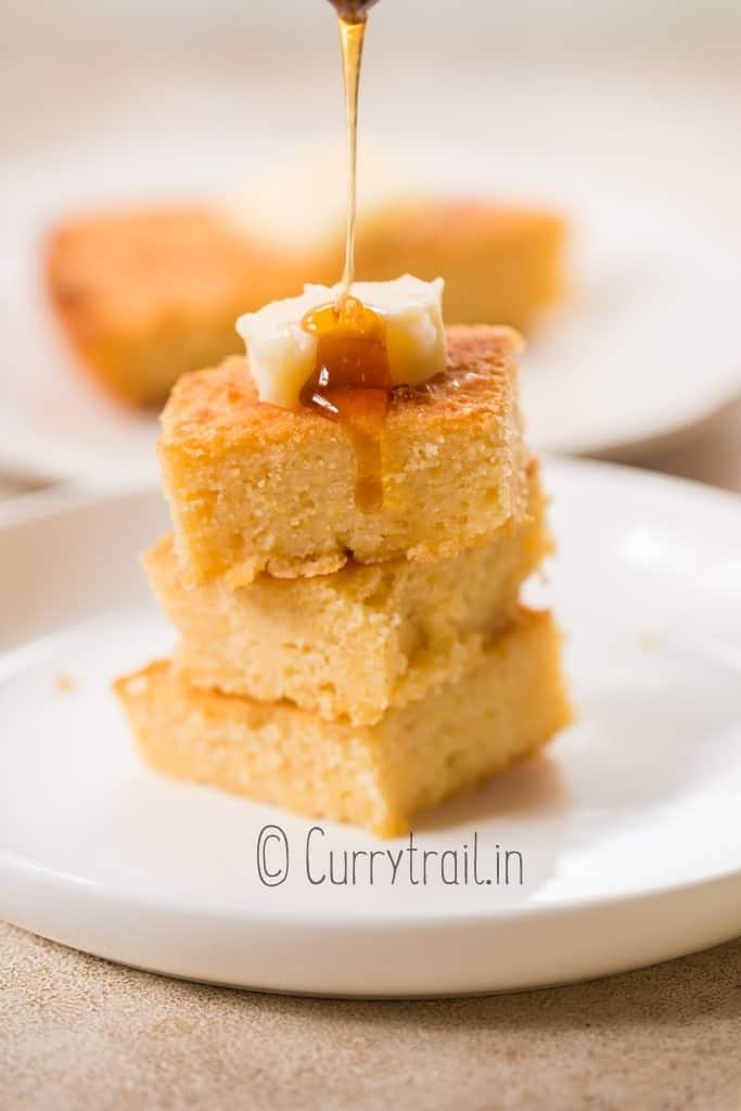 slices of buttermilk cornbread with butter and honey