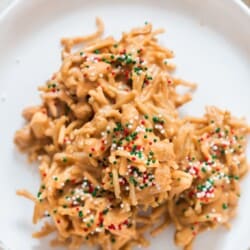 chow mein noodles haystack cookies on a white plate.