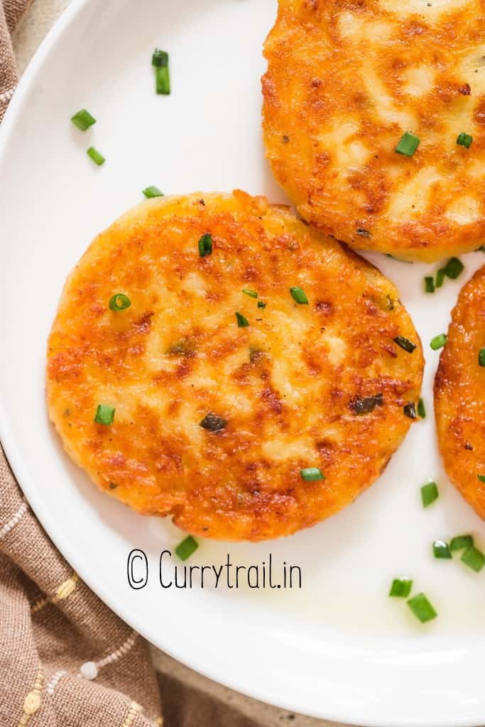 close view of crispy outside leftover mashed potato pancakes in plate