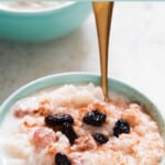 instant pot rice pudding served in ceramic bowl with text overlay