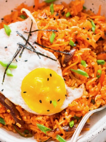 Korean spicy fried rice made using kimchi served in bowl