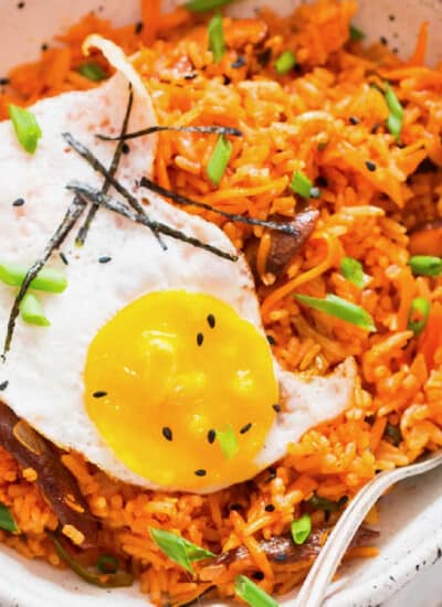 Korean spicy fried rice made using kimchi served in bowl